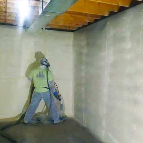 Applying SPF to basement wall